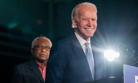 Joe Biden speaks as Jim Clyburn listens in Columbia, South Carolina, on 29 February. 