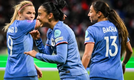 Sakina Karchaoui (centre) celebrates her penalty against Germany