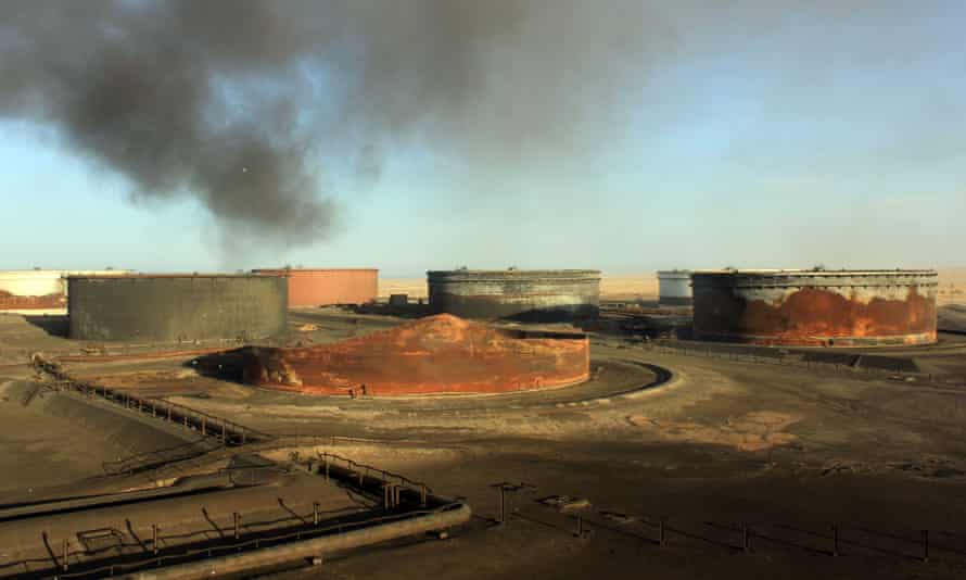 Smoke billows from a petroleum storage tank at the al-Sidra oil terminal on Libya’s northern coast