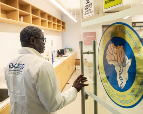 A doctor enters the laboratory at the Institute of Genomics and Global Health, in Ede, south-west Nigeria, 17 November 2025.