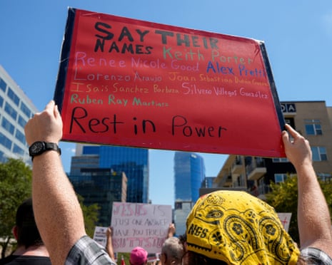 Protestors hold up signs as they march to American Airlines arena during the second day of the Republican National Convention in Dallas, 10 September 2026.