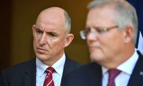 The government services minister, Stuart Robert, pictured with Scott Morrison, said Services Australia would pay ‘some 190,000 [people] from 1 July’
