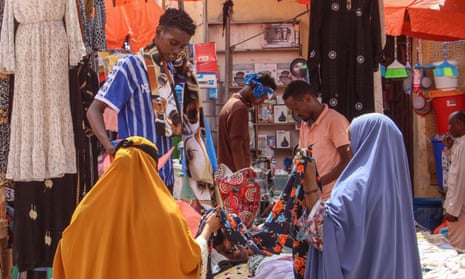 Women browse fabrics in a street market in Mogadishu, December 2023.