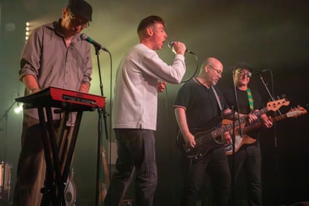 Four musicians on stage
