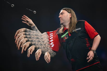 A multiple exposure of Ryan Searle in action on the oche against Jonny Clayton