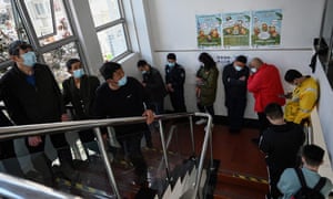 Residents line up to receive vaccines against the Covid-19 coronavirus at a community service centre in Beijing.