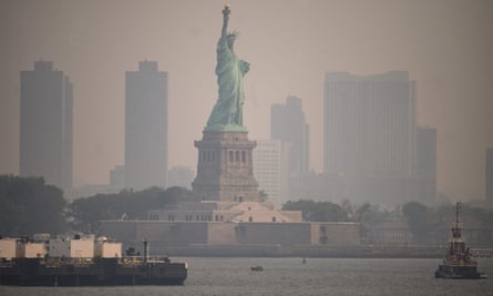 The Statue of Liberty is seen from the Staten Island ferry during heavy smog in New York.