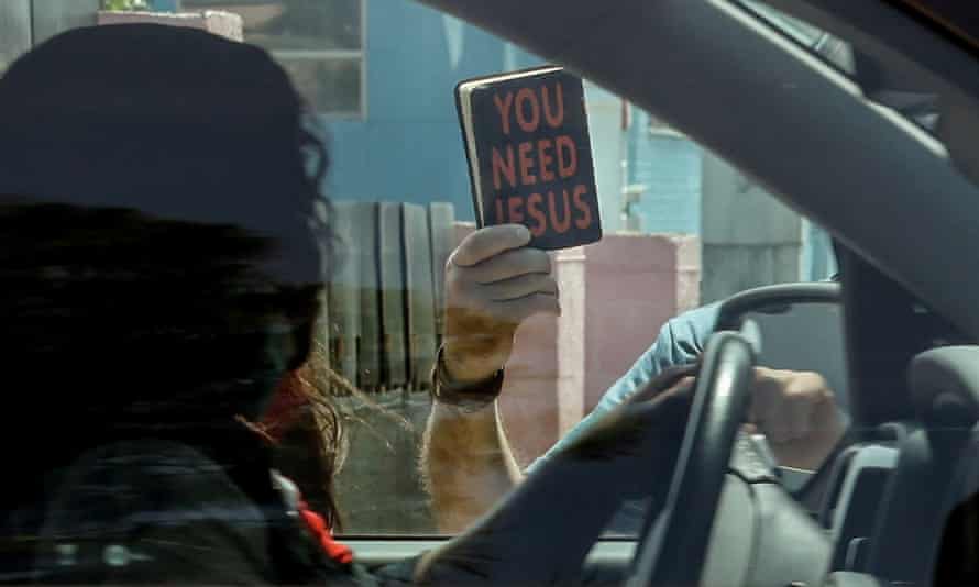 Self-proclaimed street preacher Brian Peden confronts a patient in her car as she leaves the Pink House.