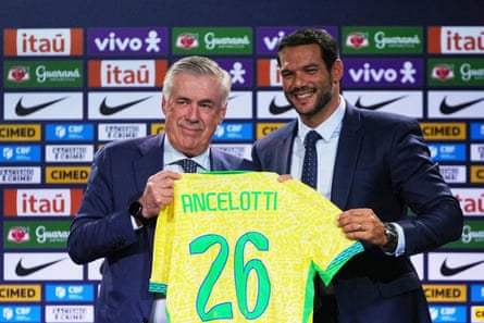 Carlo Ancelotti, left, receives a Brazil jersey from CBF president, Samir Xaud