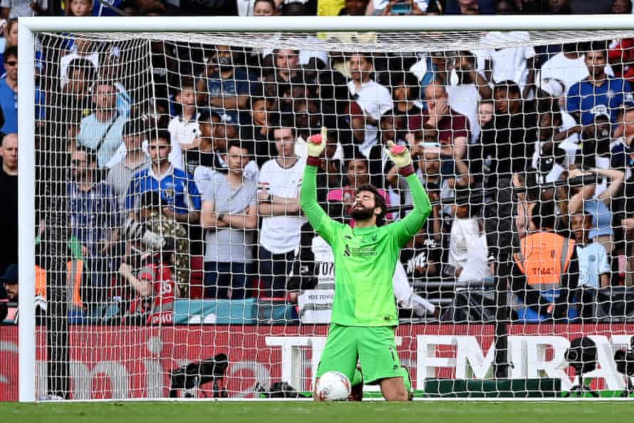 Liverpool keeper Alisson celebrates after saving the seventh penalty from Mason Mount of Chelsea.