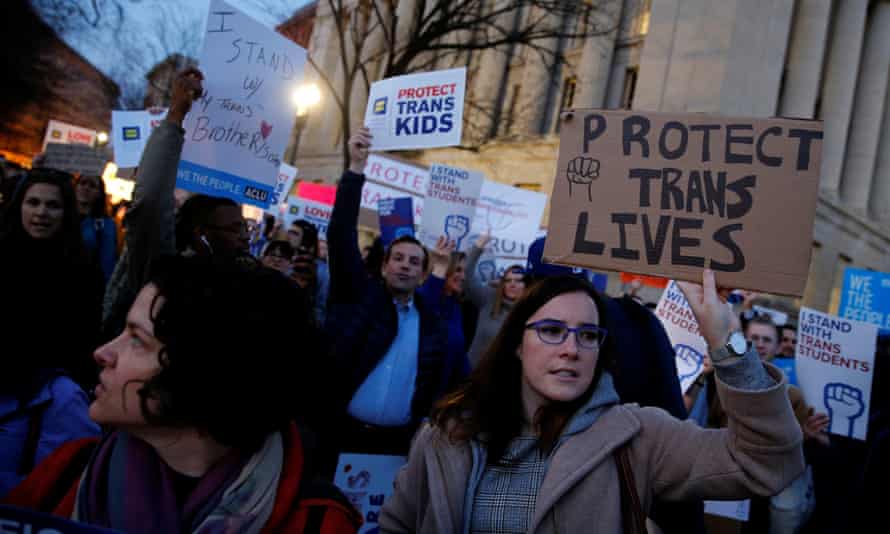 Transgender activists and supporters protest near the White House.