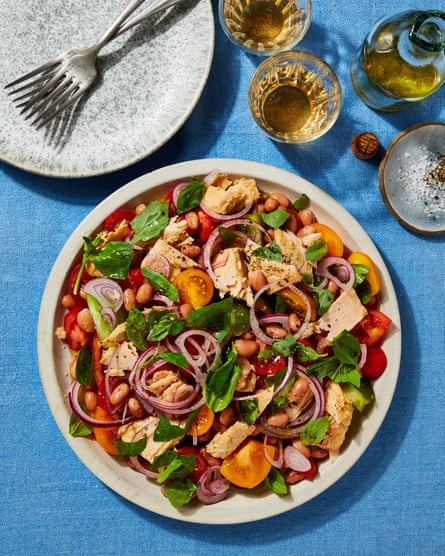 Chris Shaw’s cranberry bean, tuna, tomato, red onion and basil salad, served with glasses of white wine.