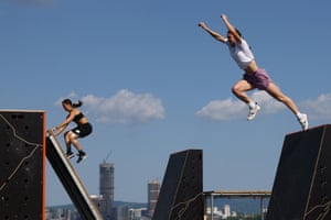 Kseniya Momchilova and Sara Banchoff Tzancoff take part in a parkour competition at the World Games in Chengdu