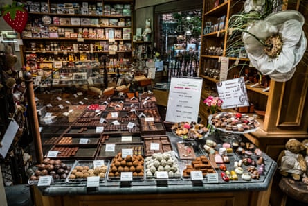 a display of truffles and other sundries in the counter of a chocolate shop in bruges belgium