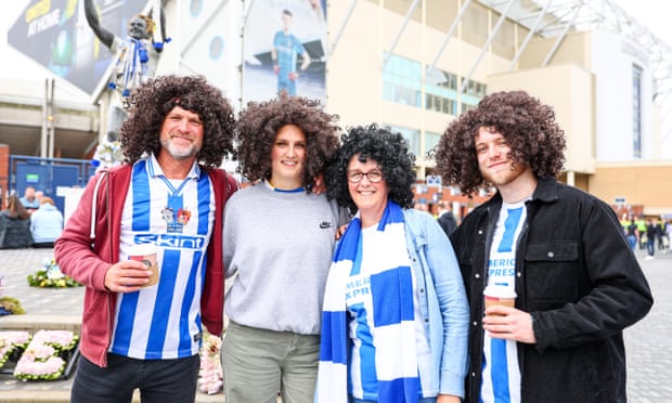 Brighton fans wear Marc Cucurella wigs outside Elland Road in May.