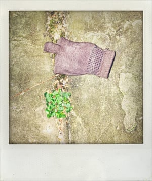 An old ruined fingerless glove found on a footpath in London 3-11-2019. The signs intensified