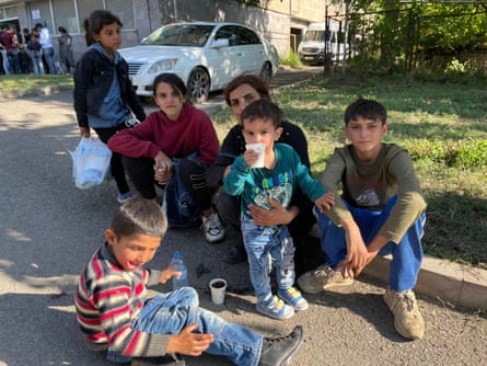 Volunteer Muriel Talin Clark, who speaks Armenian, with young refugee children from Nagorno-Karabakh in Vayk, Armenia, in September 2023.