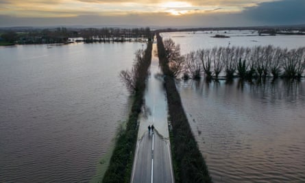 Flood water surrounds the A361 road