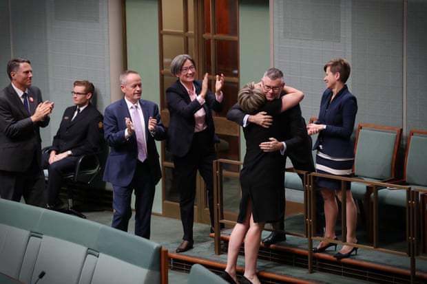 Tanya Plibersek hugs senator Murray Watt.