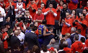 Kevin Durant walks off the court with the trainer after his injury