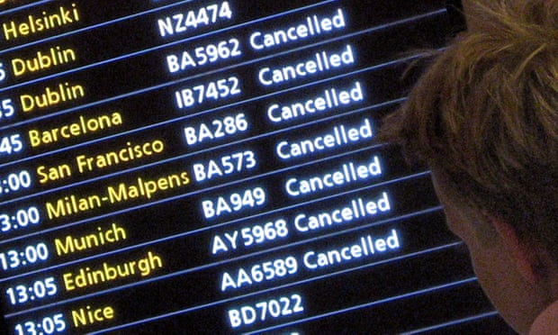 A passenger looks at a departures board