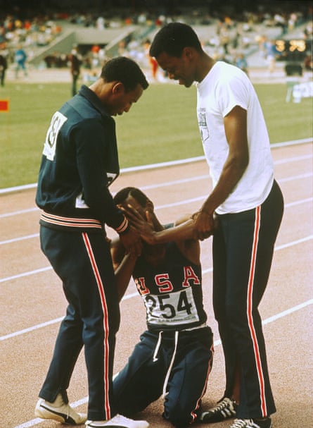 Beamon being supported by teammates at the 1968 Olympics.