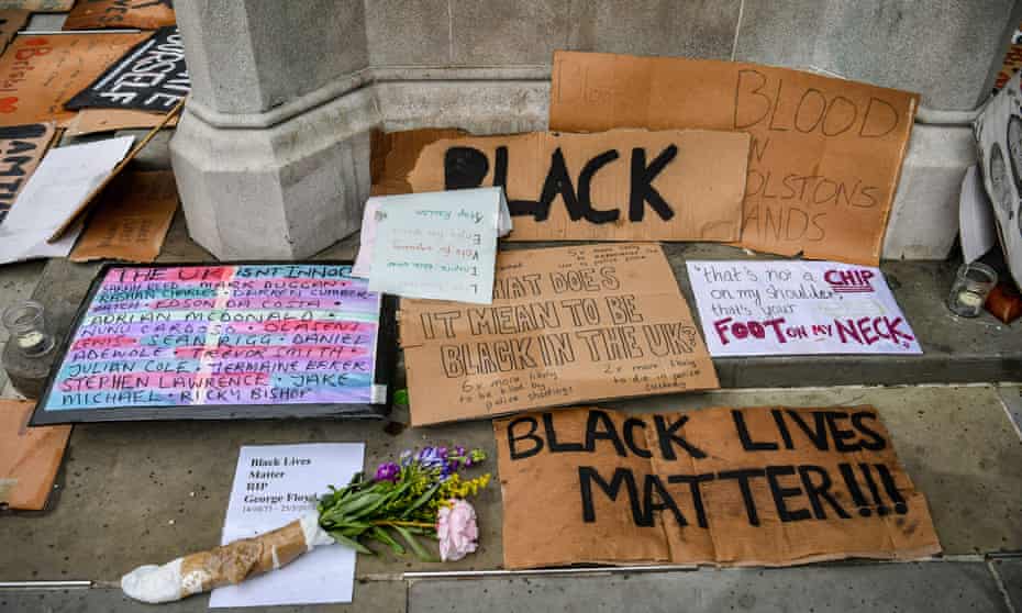 Black Lives Matter signs and placards at the base of the Edward Colston statue plinth in Bristol city centre in June. 