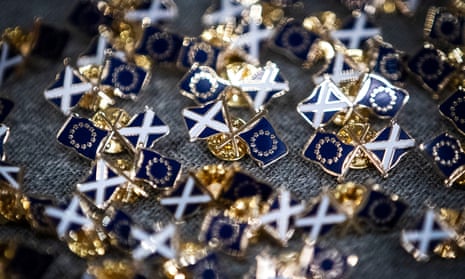 Pin badges showing the Saltire and EU flags at a Stay in Scotland event in Edinburgh.