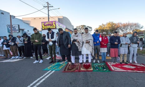 Crowds spill into the street and neighbouring houses and gardens for the traditional prayers of thanks during the Eid al-Fitr end of Ramadan celebration in Lakemba.