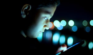 young boy using smartphone