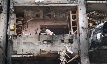 A woman amid the rubble of a missile strike in Kyiv on Friday.