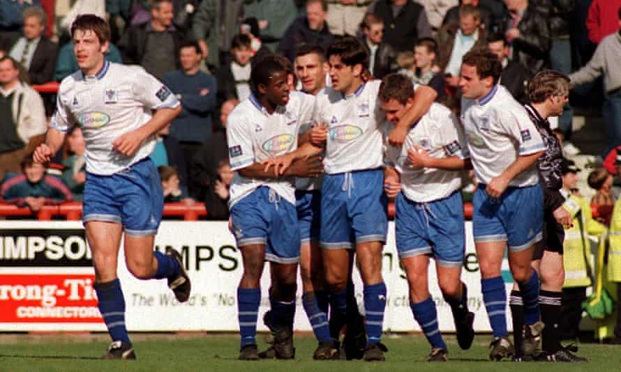 Andy Woodward, middle, celebrates with his Bury team-mates after a goal against Brentford in March 1997.