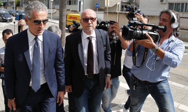 Film director Paul Haggis, center, arrives at the court with his lawyer, Michele Laforgia, in June.