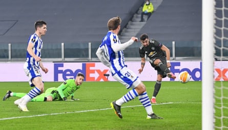 Manchester United’s Bruno Fernandes scores the opening goal of a 4-0 rout in the 2020-21 Europa League as Alex Remiro watches on