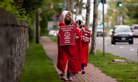 Demonstrators dressed in Handmaid’s Tale outfits leave the Chevy Chase Club, where Brett Kavanaugh is a member, in Maryland on 12 May. 