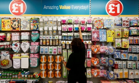 Poundland employee checking products in a store in London