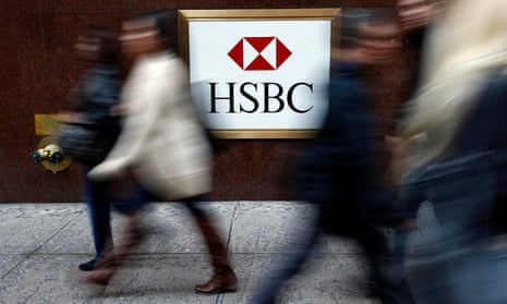 People walk past a HSBC bank branch in midtown Manhattan in New York City.
