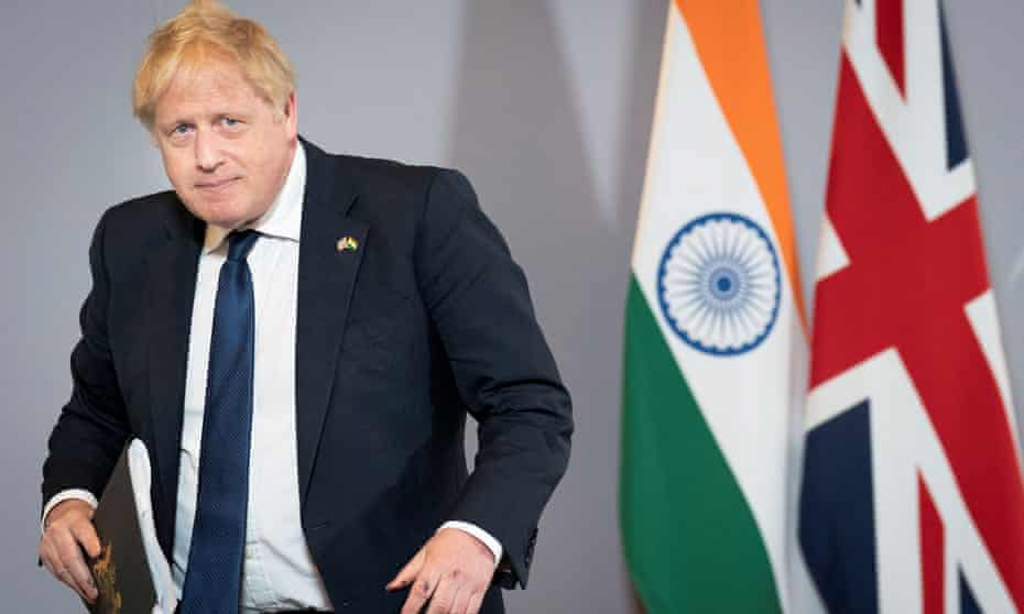 Boris Johnson attends a news conference in New Delhi, India