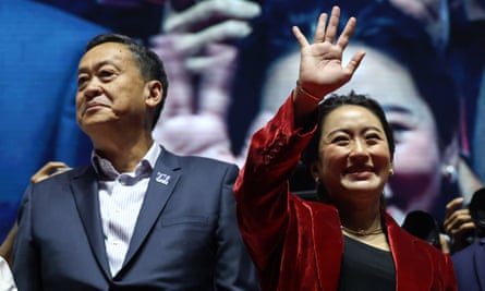 Pheu Thai’s prime ministerial candidates, Srettha Thavisin (L) and Paetongtarn Shinawatra, greet supporters during the party’s final campaign event.