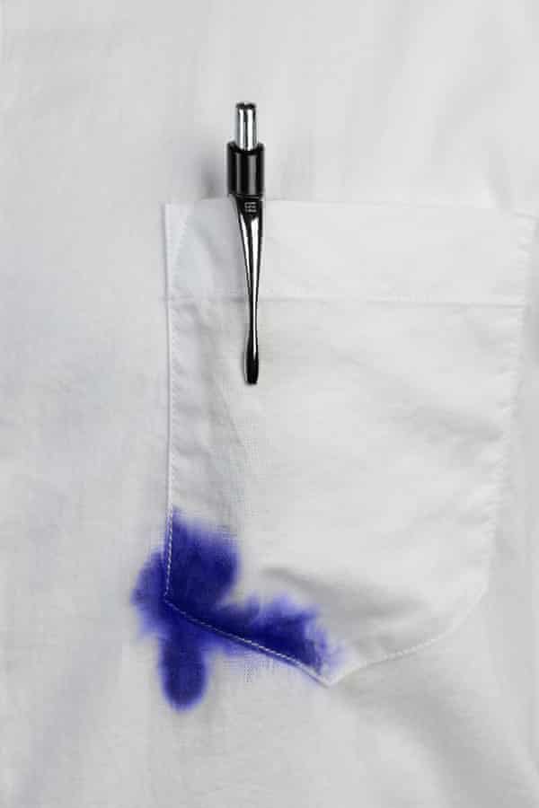 Close up of white shirt with blue ink stain on pocket