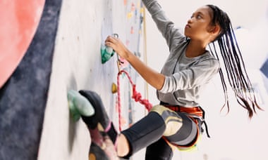 Teenage Rock Climber on Climbing Wall