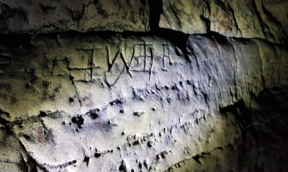 weird markings on a rock wall