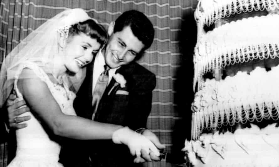 Debbie Reynolds and Eddie Fisher cutting their wedding cake, 1955.