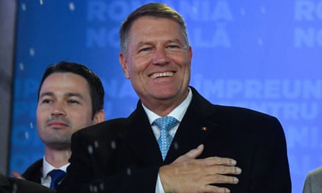 Klaus Iohannis addresses supporters at the ruling National Liberal party (PNL) headquarters in Bucharest on Sunday.