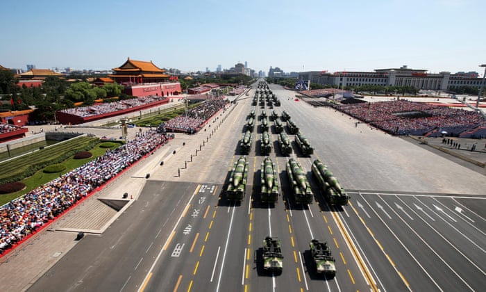 Armoured vehicles rolling through Tiananmen Square during the military parade.