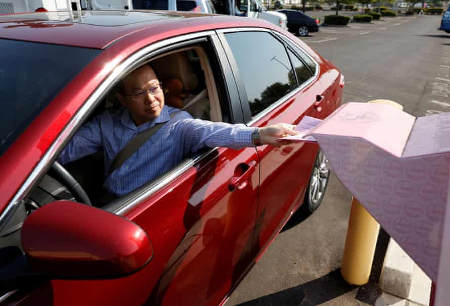 A voter drops off their mail-in ballot as California goes to the polls in a gubernatorial recall election.