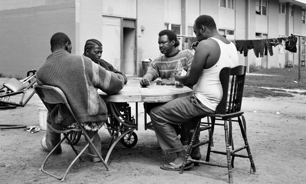 Men play dominoes at Imperial Courts in 1993