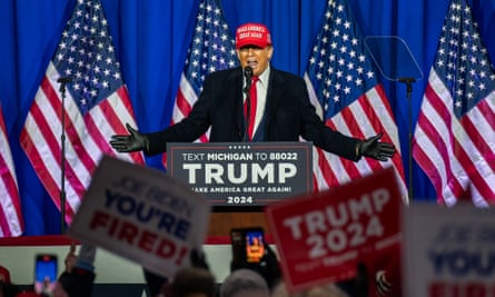 Donald Trump speaking at a political rally.