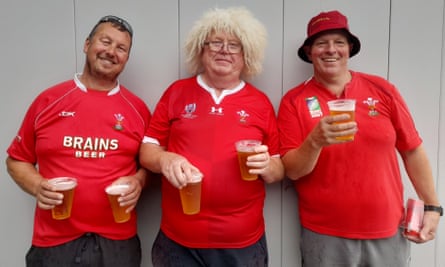Tony Murphy (centre) is flanked by friends Gareth, wearing the hat, and Huw before Wales’s game against Portugal in Nice