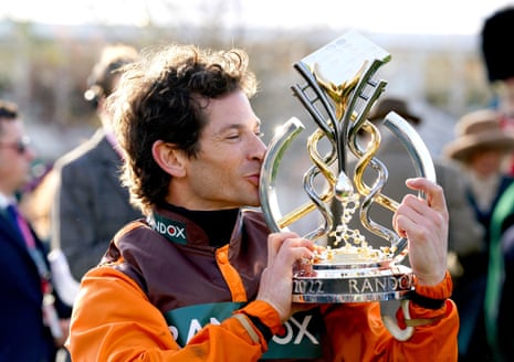 Jockey Sam Waley-Cohen kisses the trophy after winning the Grand National.